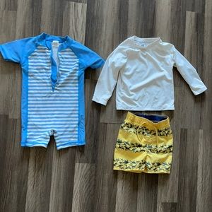 Set of 2 baby boy swimsuits.